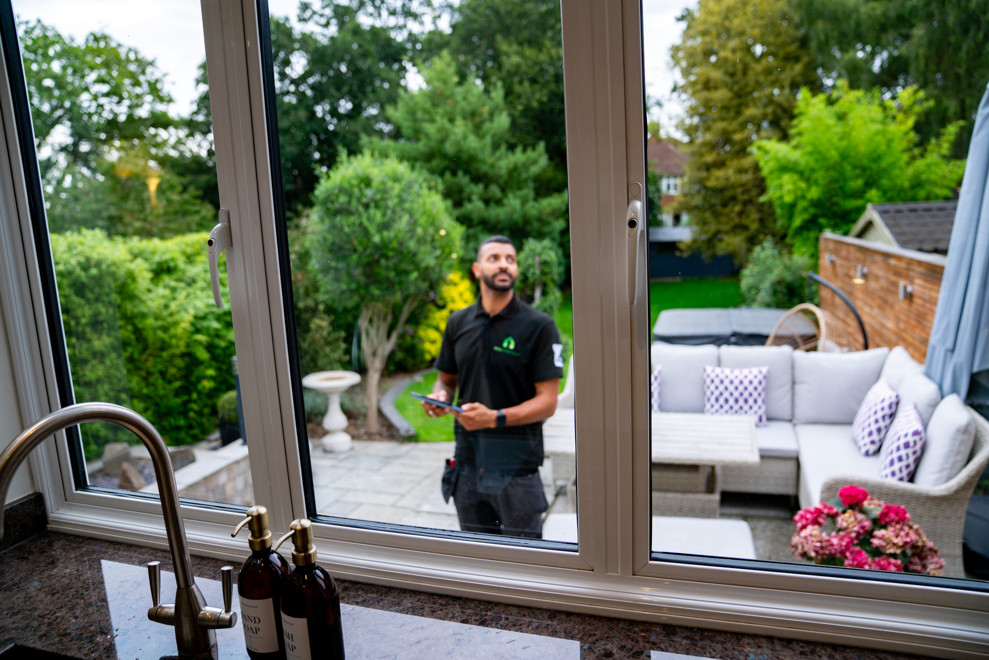 EPC assessor standing outside in the garden of a house